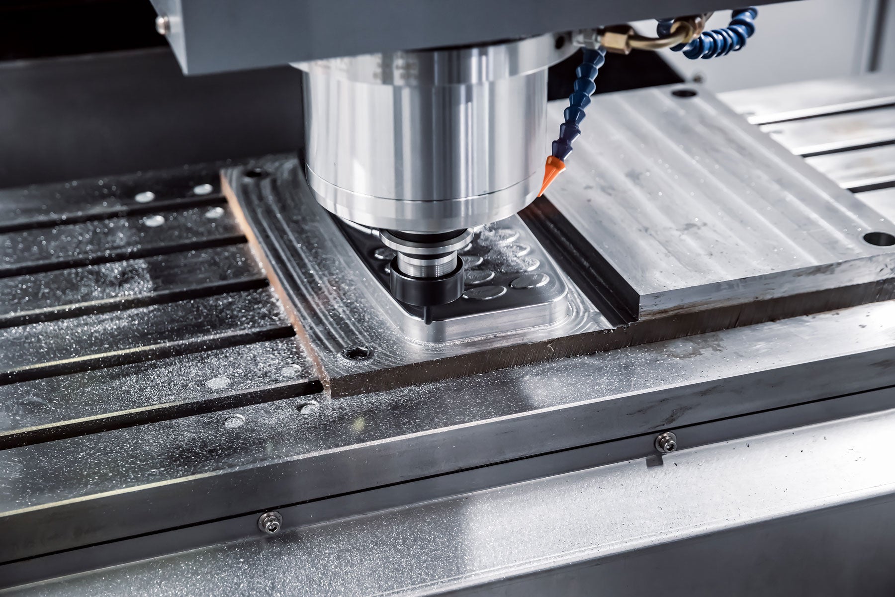 CNC milling operation in progress for metal fabrication.