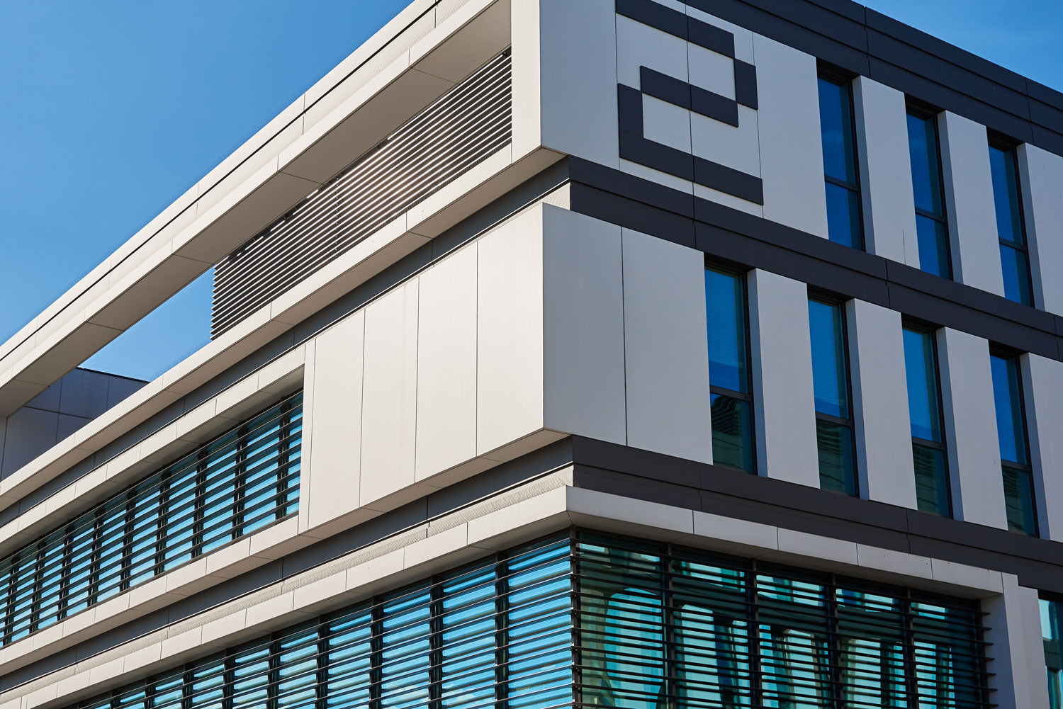 Exterior of a commercial building with CNC-fabricated metal cladding.