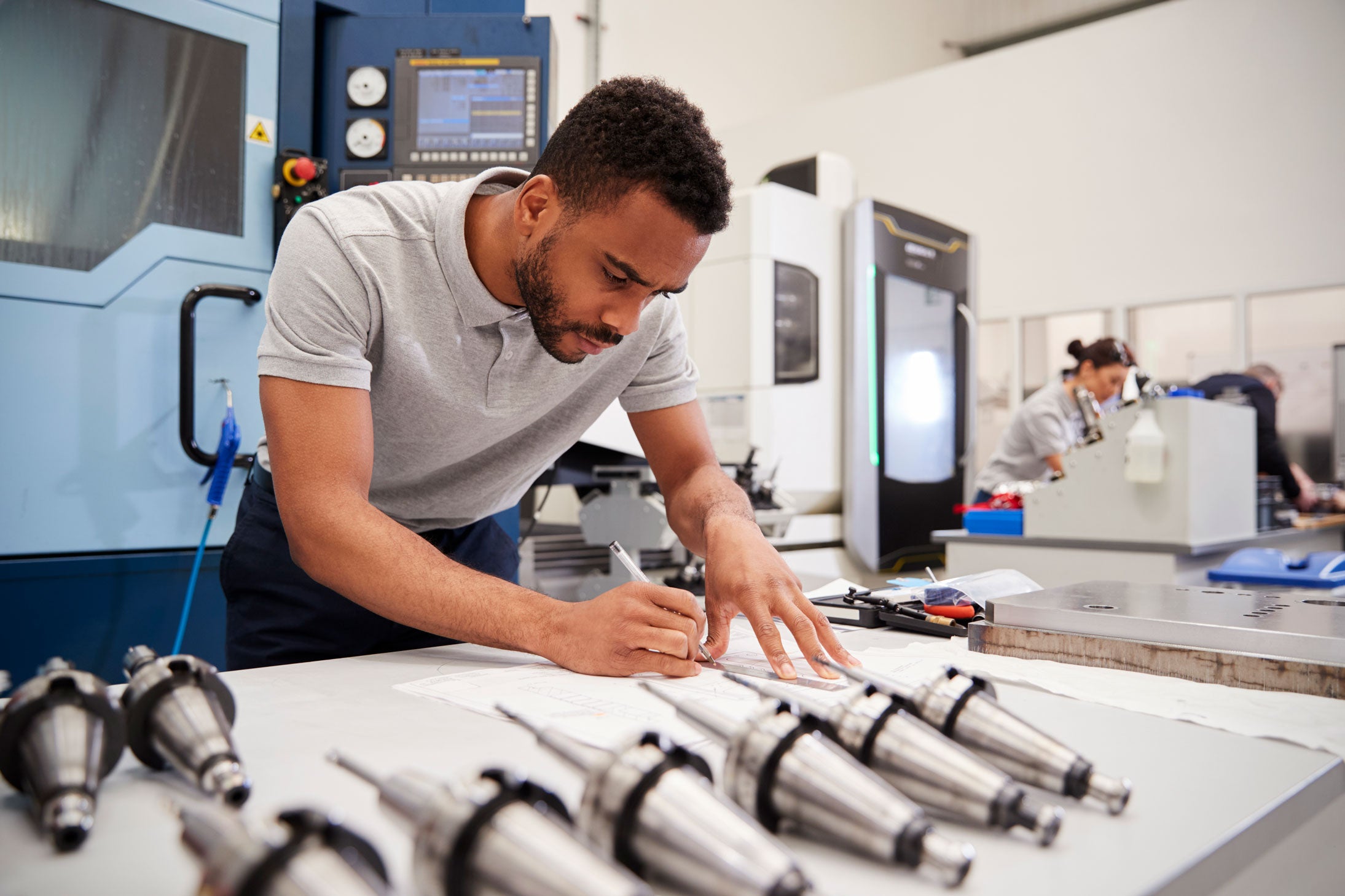Engineer taking precision measurements for CNC prototyping.